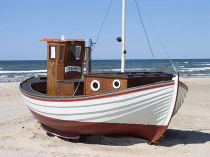 Wooden Fishing Boat on the Sand