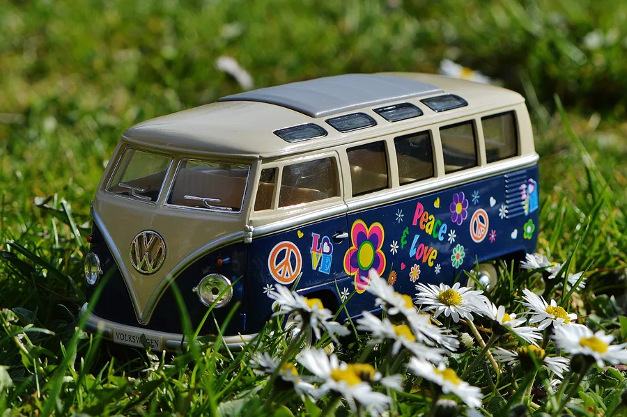 A Toy Volkswagen Bus Among Daisies