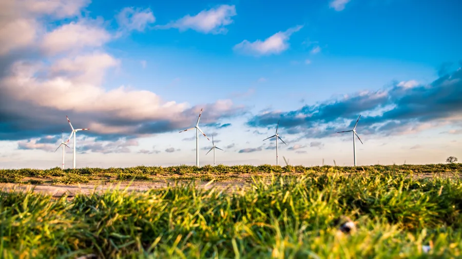 Wind Turbines Over a Grassy Field