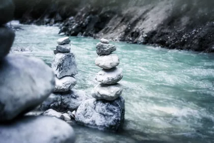 Stone Cairns Beside a River