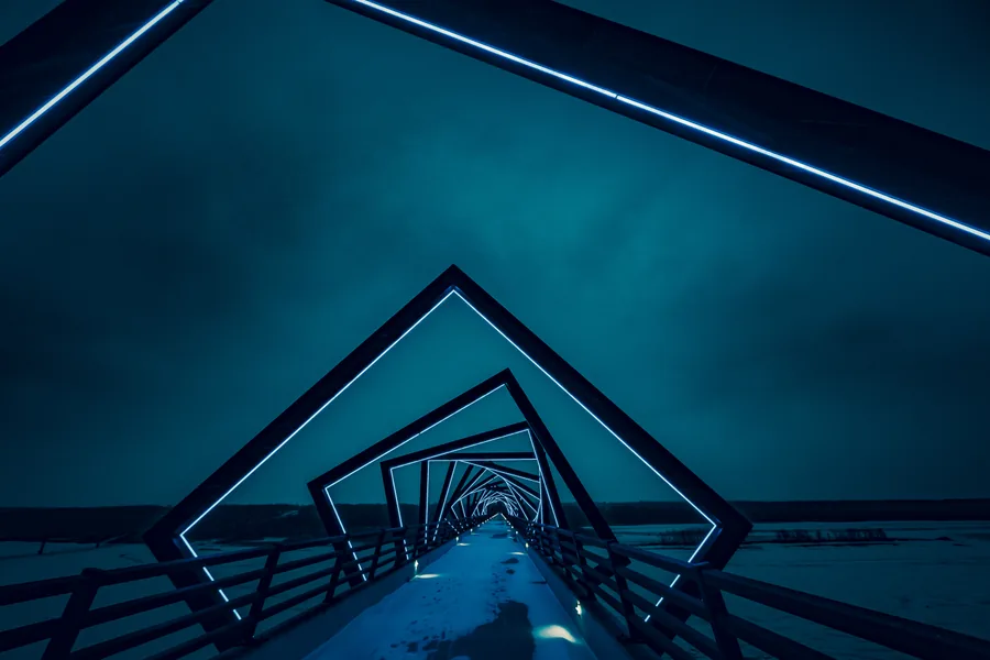A Lit Footbridge at Night