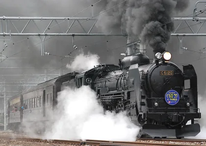 A Steam Locomotive Under Billowing Smoke