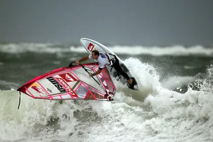 Windsurfer Launching Off a Wave