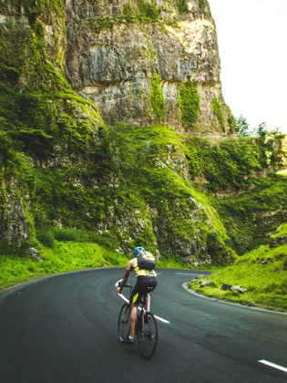 A Cyclist on a Winding Gorge Road