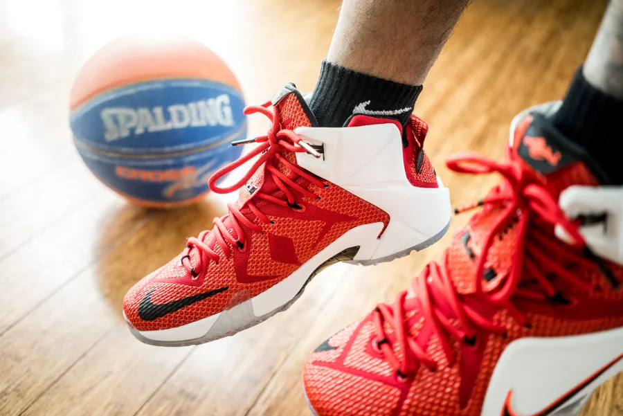 Red Basketball Shoes on a Wooden Floor