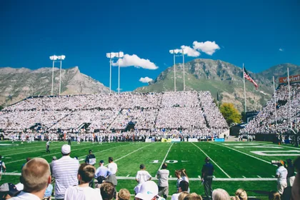 A Packed Stadium Below the Mountains