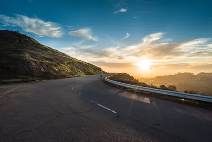 Runner on a Hilltop Road