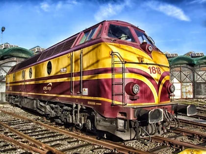 A Maroon and Yellow Diesel Locomotive