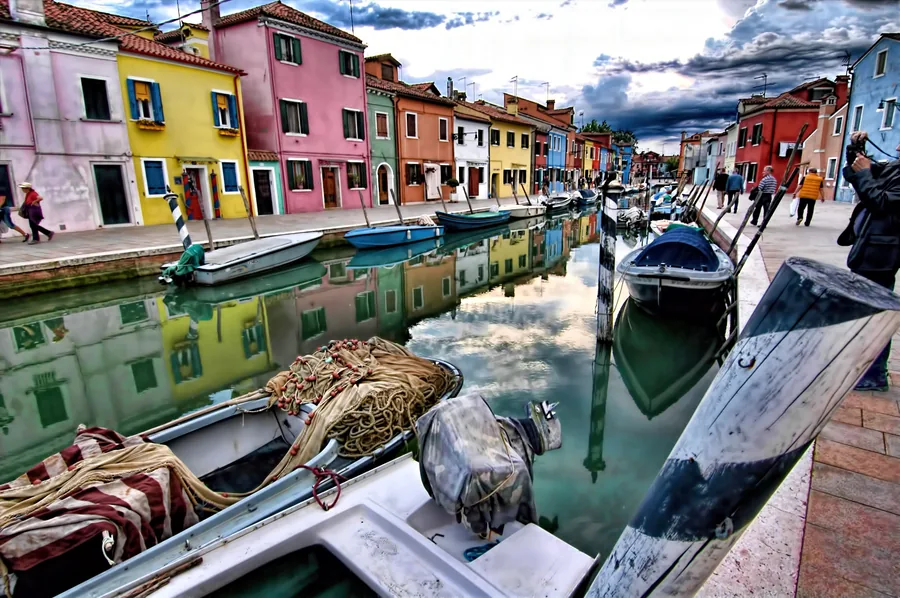 Boats and Pastel Houses Beside a Canal