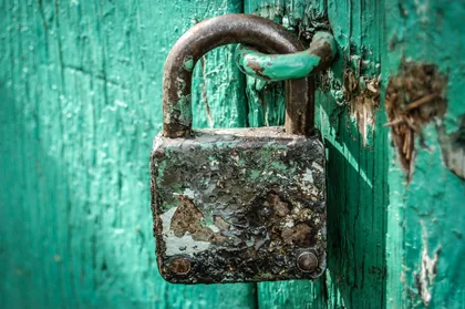Padlock on a Green Door